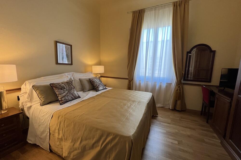 Foto de una habitación de Hotel Villani